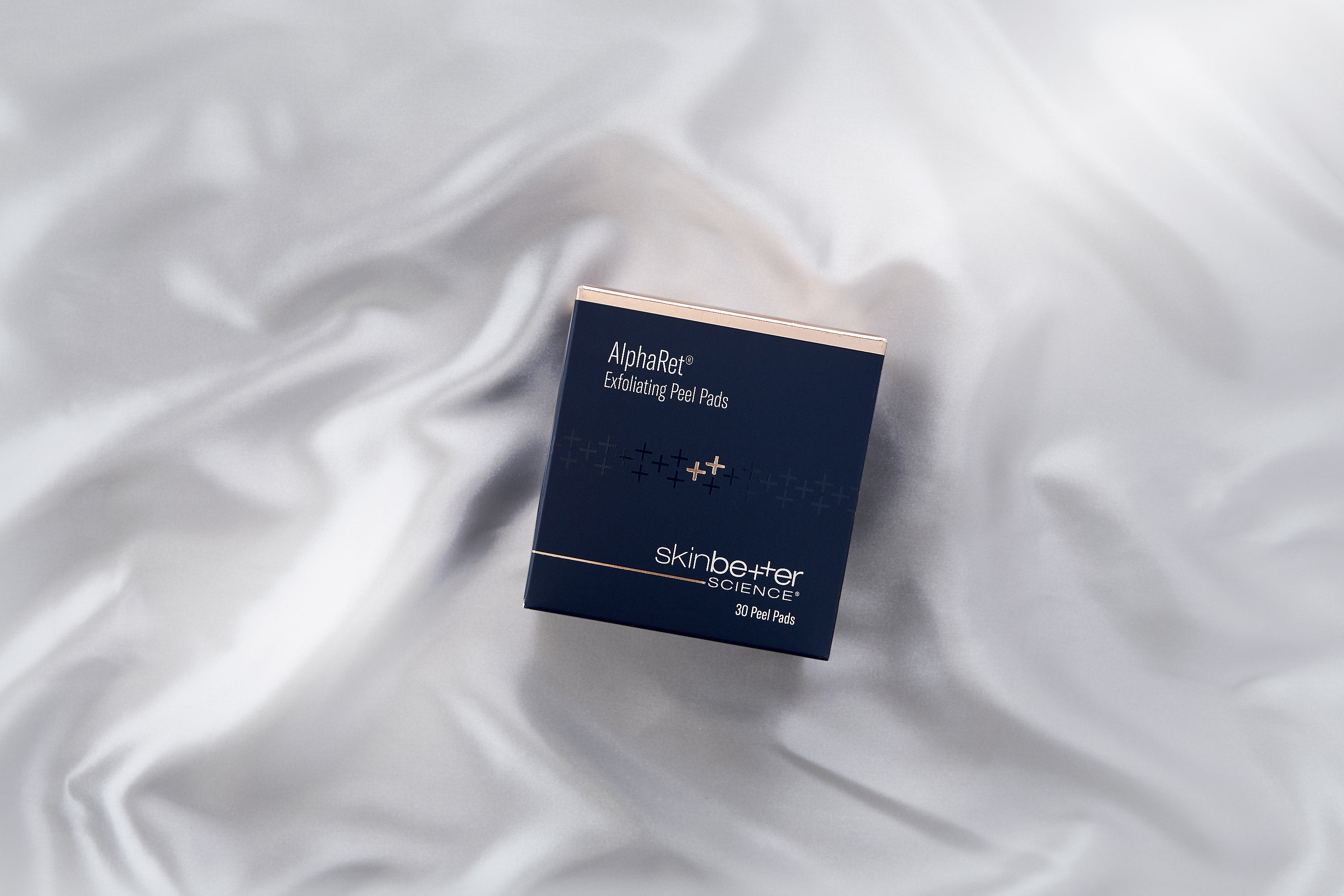 SkinBetter AlphaRet Exfoliating Peel Pads, styled product shot, at FRZN Aesthetics in Frisco, TX